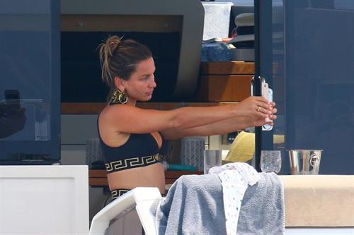 Sam Faiers Bikini Pictures Sam Faiers sexy in a black versace bikini seen by paparazzi showing nice cleavage.