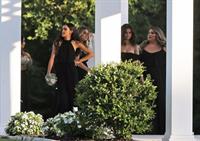 Selena Gomez sexy in a black dress for her cousins wedding showing nice cleavage seen by paparazzi.























