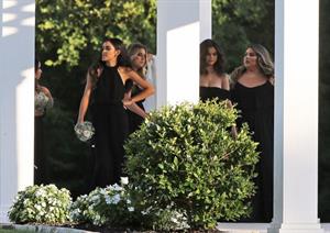 Selena Gomez sexy in a black dress for her cousins wedding showing nice cleavage seen by paparazzi.























