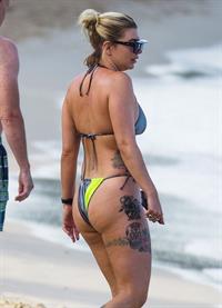 Olivia Buckland sexy in a bikini at the beach seen by paparazzi showing nice cleavage.



