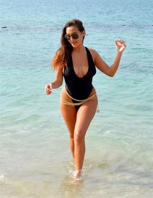 Chloe Goodman big boobs showing nice cleavage in a low cut swimsuit at the beach seen by paparazzi.







