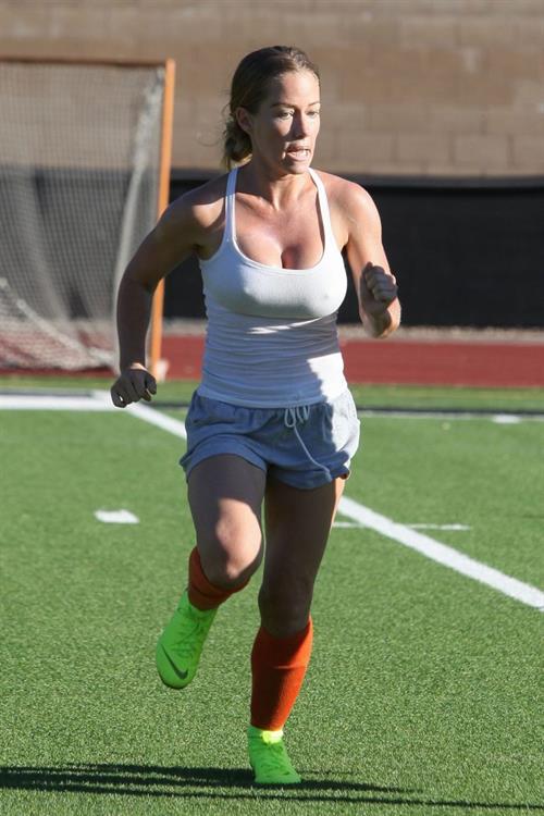 Kendra Wilkinson Pictures Kendra Wilkinson braless boobs showing her tits pokies seen by paparazzi playing soccer seen by paparazzi.