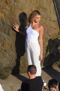 Hailey Bieber braless nipples pokies in a white top at the beach seen by paparazzi during a photo shoot.



















