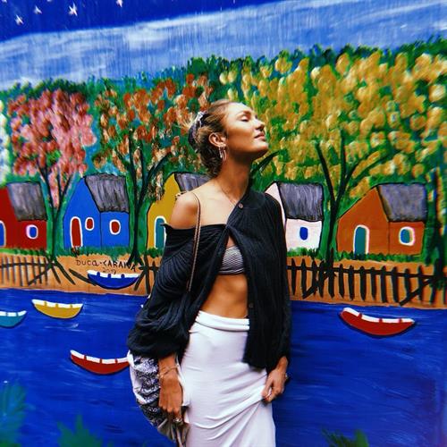 Candice Swanepoel nipple in a see through little little top.























