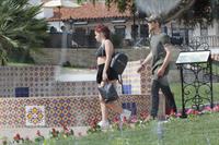 Ariel Winter paparazzi pictures in black bikini top and short skirt