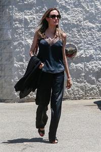 Angelina Jolie braless tits pokies in a black top seen by paparazzi showing her hard nipples.





























