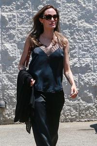 Angelina Jolie braless tits pokies in a black top seen by paparazzi showing her hard nipples.





























