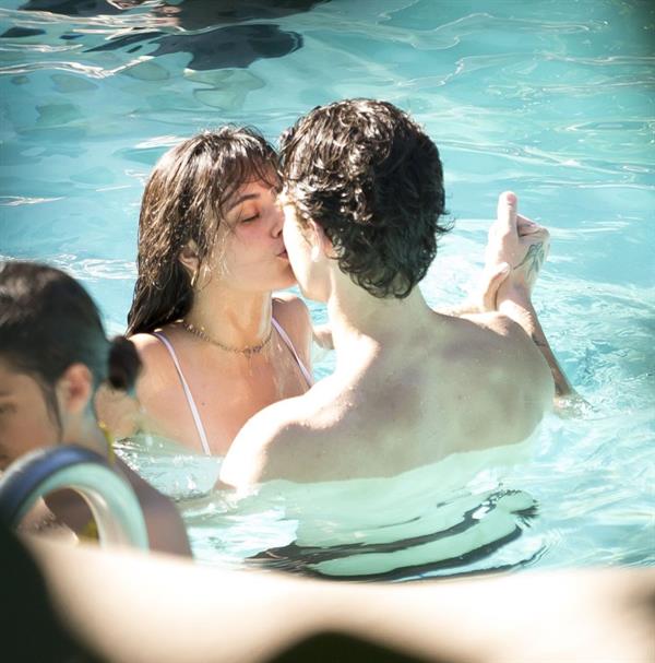 Camila Cabello and Shawn Mendes making out in the water seen by paparazzi kissing.





































