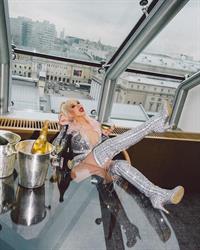 Christina Aguilera showing some nice cleavage with her big tits in a low cut outfit.












