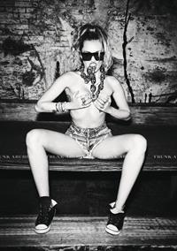 Miley Cyrus nude and sexy photo shoot for Von Magazine showing her topless boobs.










