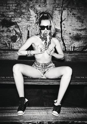 Miley Cyrus Pictures Miley Cyrus nude and sexy photo shoot for Von Magazine showing her topless boobs.