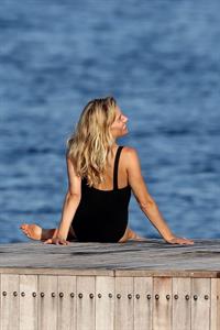 Sienna Miller nip slip wardrobe malfunction boobs popping out of her swimsuit caught by paparazzi.







