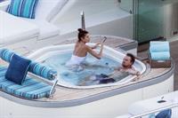 Camila Morrone in a sexy swimsuit in a hot tub on a yacht with Leonardo DiCaprio seen by paparazzi.










