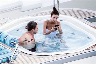 Camila Morrone in a sexy swimsuit in a hot tub on a yacht with Leonardo DiCaprio seen by paparazzi.










