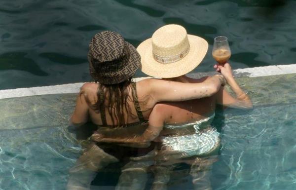 Miley Cyrus and Kaitlynn Carter making out kissing by the pool seen by paparazzi showing her lesbian side after leaving Liam Hemsworth.




