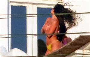 Martha Kalifatidis caught topless by paparazzi with her hand covering her nude big boobs.





