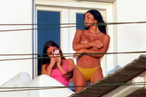 Martha Kalifatidis Pictures Martha Kalifatidis caught topless by paparazzi with her hand covering her nude big boobs.