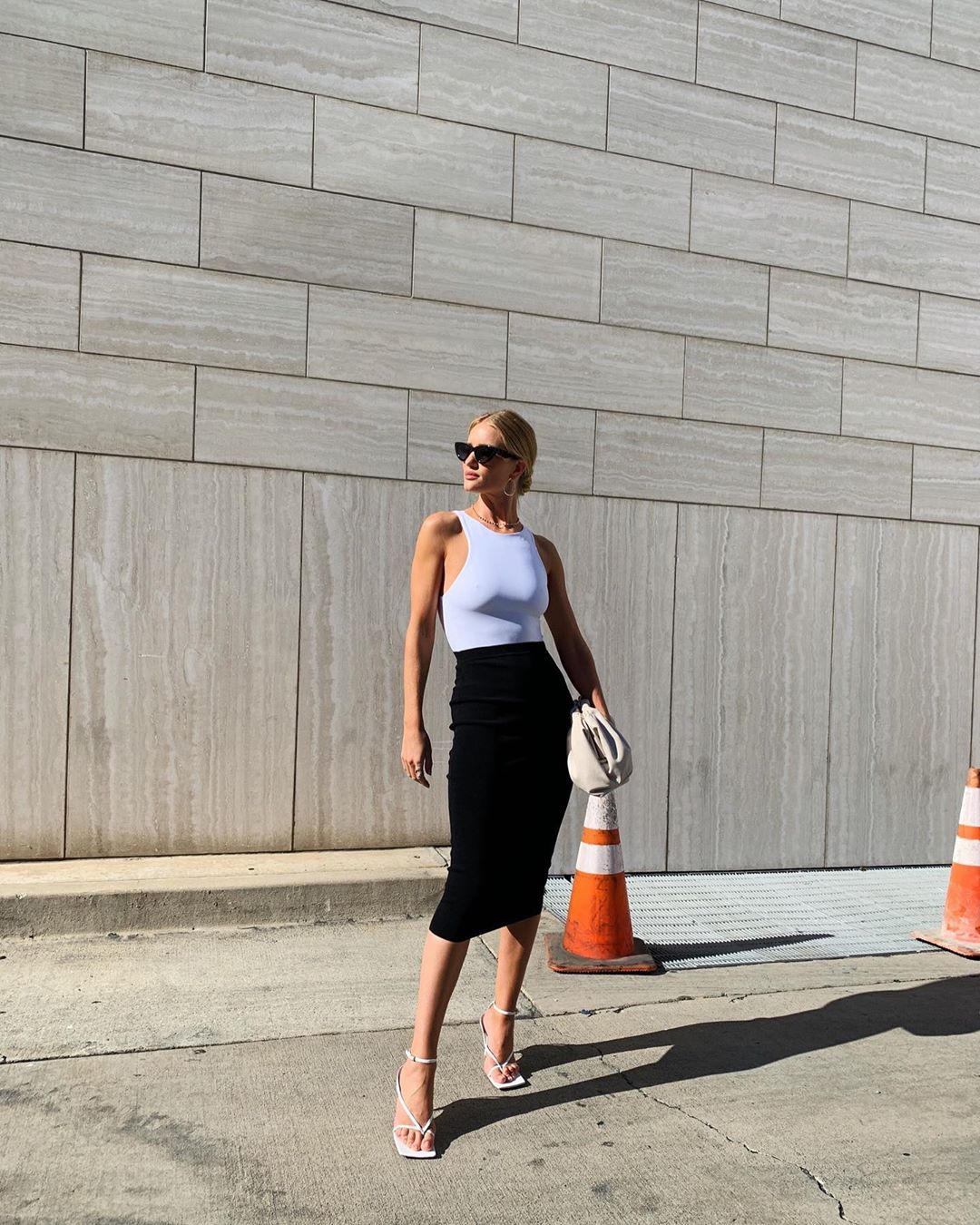 Rosie Huntington-Whiteley Pictures Rosie Huntington-Whiteley braless tits in a tight white top showing off her boobs.