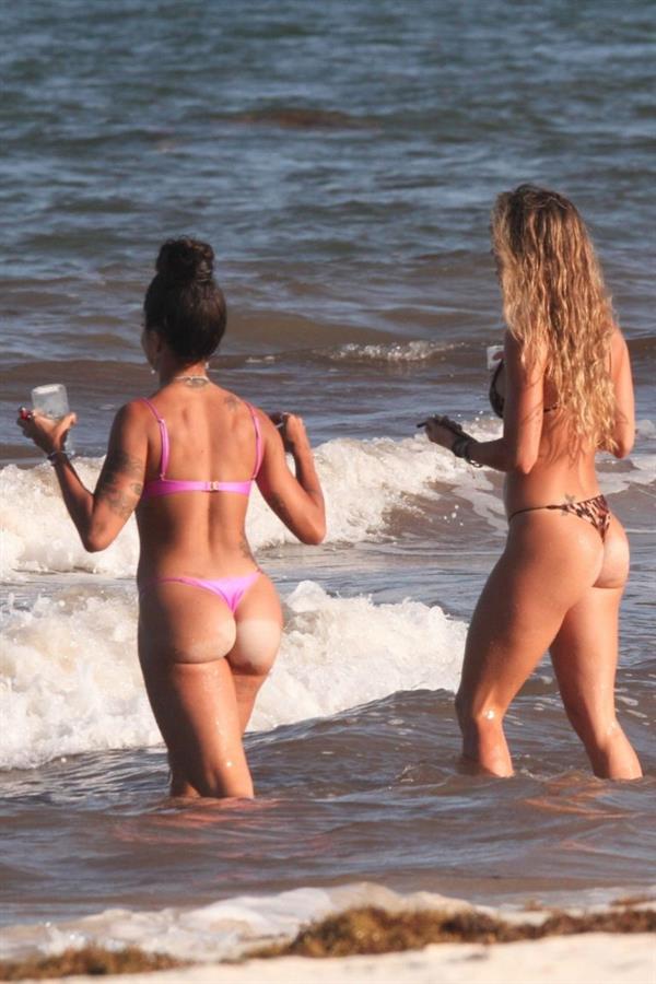 Aline Riscado seen at the beach by paparazzi in a sexy ass thong bikini showing nice cleavage.


