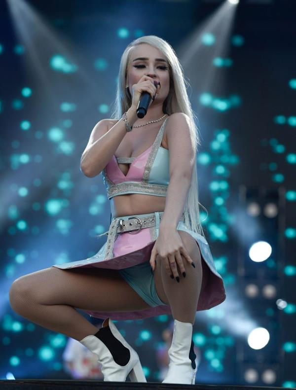 Kim Petras upskirt on stage singing and showing her panties.







