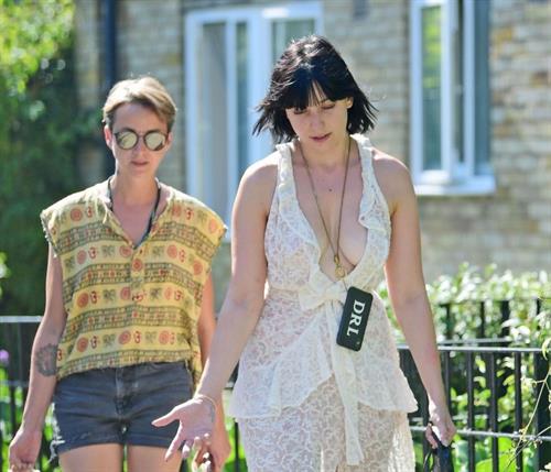 Daisy Lowe Pictures Daisy Lowe braless boobs in a see through dress showing off her tits and cleavage seen by paparazzi.