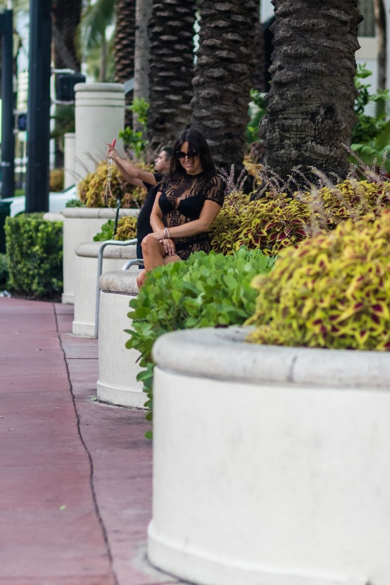 Claudia Romani Pictures Claudia Romani sexy ass in a see through dress in a black bra and thong panties seen by paparazzi.