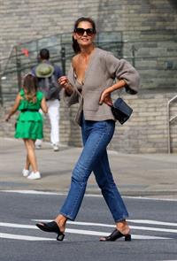 Katie Holmes sexy cleavage seen by paparazzi in a revealing outfit.

