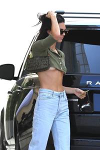 Kendall Jenner braless boobs showing nice underboob cleavage seen by paparazzi in a revealing little top.




