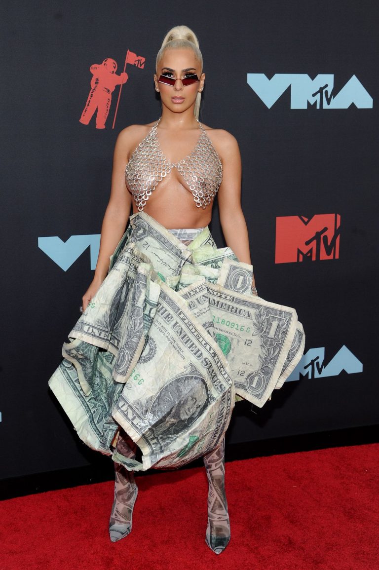 Veronica Vega Pictures Veronica Vega showing off her braless boobs on the red carpet at the MTV VMA's in a see through top.