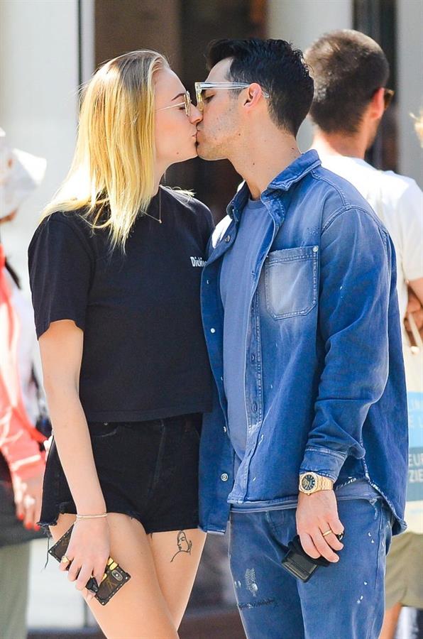 Sophie Turner braless boobs kissing Joe Jonas seen by paparazzi.
















