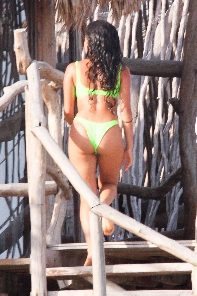 Vanessa Morgan Bikini Pictures Vanessa Morgan in a tight green bikini showing nice cleavage and her sexy ass seen by paparazzi.