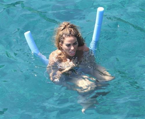 Katie Price Pictures Katie Price caught nude with her son by paparazzi showing her topless boobs.