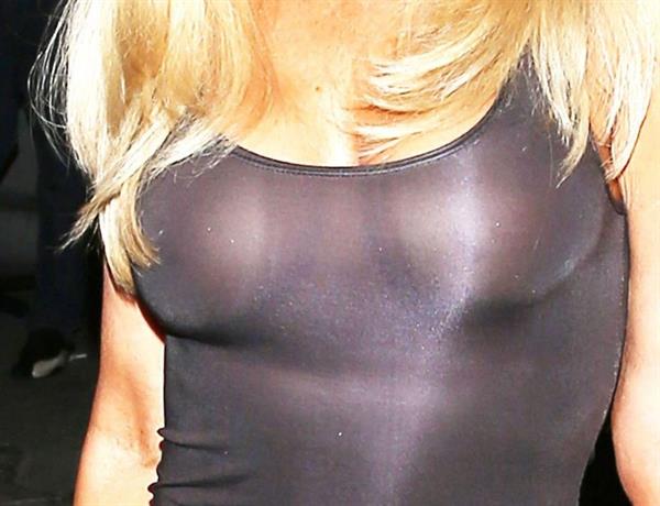 Donna D’Errico braless boobs in a see through dress showing off her tits seen by paparazzi.















































