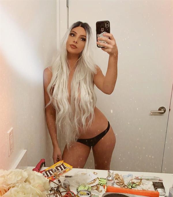 Lele Pons topless new photo in just panties with her hair covering her nude boobs.






















