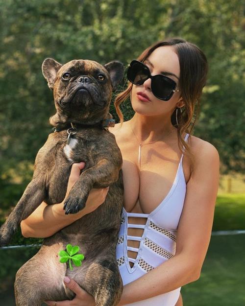 Elizabeth Gillies Pictures Elizabeth Gillies big boobs showing nice cleavage in a low cut swimsuit.