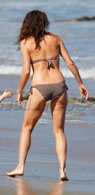 Minnie Driver in a bikini - ass