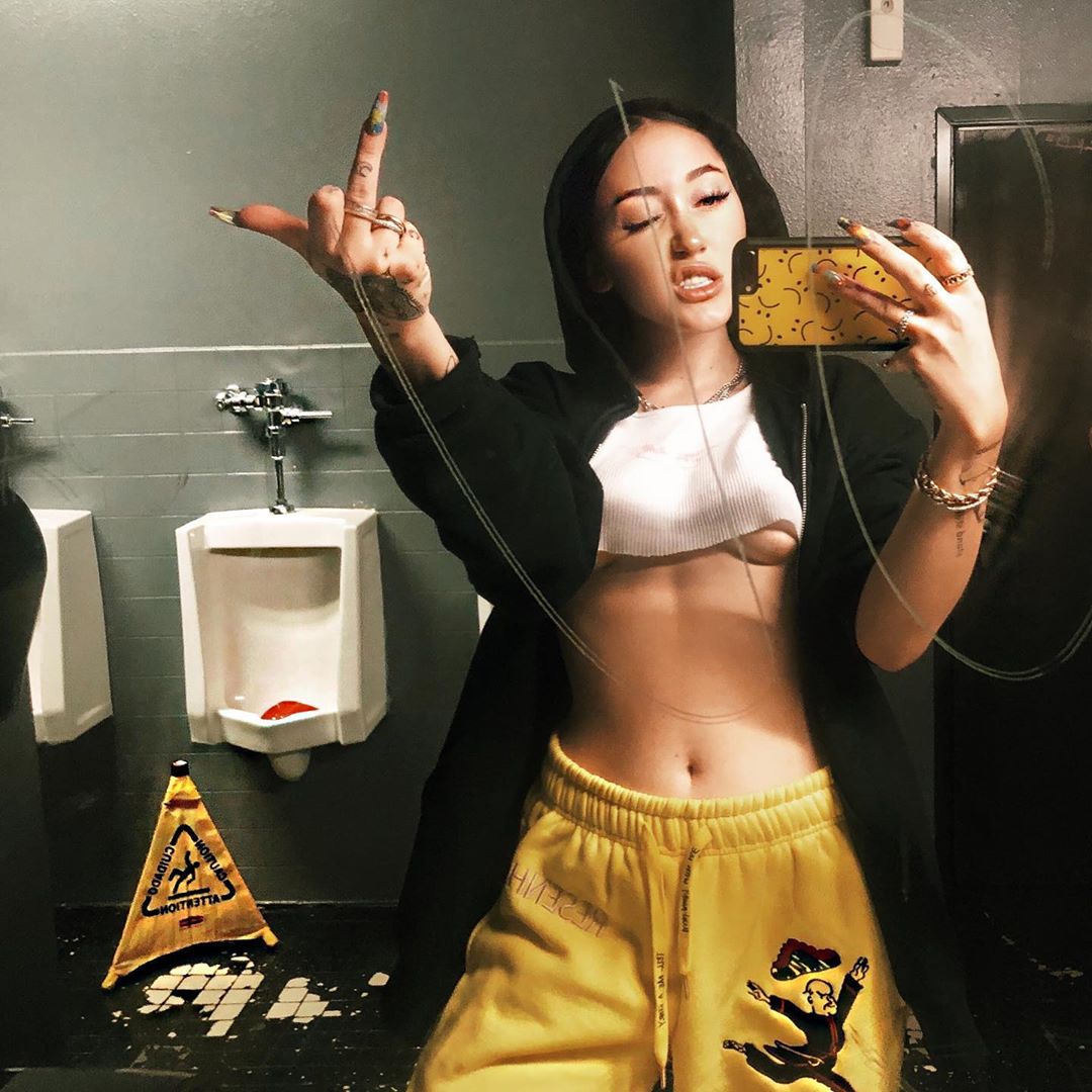 Noah Cyrus braless and sexy in a small white top showing off her tits and u...