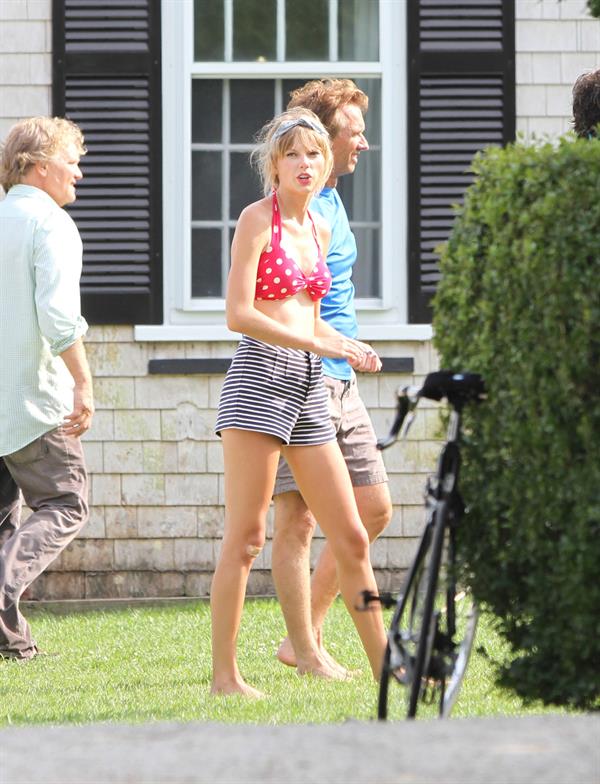 Taylor Swift wearing a bikini top and swimsuit in Hyannis on April 12, 2013