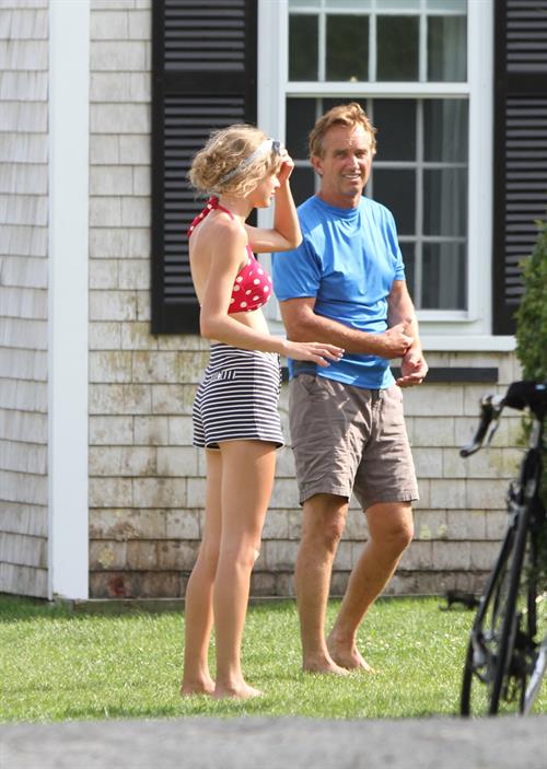 Taylor Swift wearing a bikini top and swimsuit in Hyannis on April 12, 2013