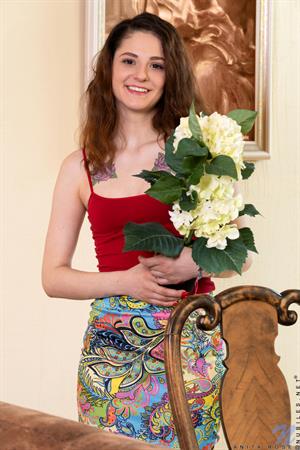 Sweet and flirty, Anita Rose knows she's hot and isn't afraid to flaunt it. She's a total wildcat when you get her alone, flashing her panties and then her tits for you. As her clothes come off, her hands are everywhere, caressing her breasts then sliding lower to slide in and out of her hairy twat. 