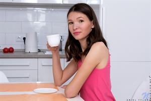 There's nothing hotter than a willowy cutie like Ariel Tylor as she just chills in the morning. As she enjoys her quiet morning, she starts slipping out of her clothes and letting her hands explore her slender curves. When she reaches her bare pussy, she can't help but start masturbating!