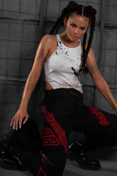 Selena Gomez braless boobs showing off her tits pokies in a white tank top as well as showing her ass in tight pants for Interview magazine.