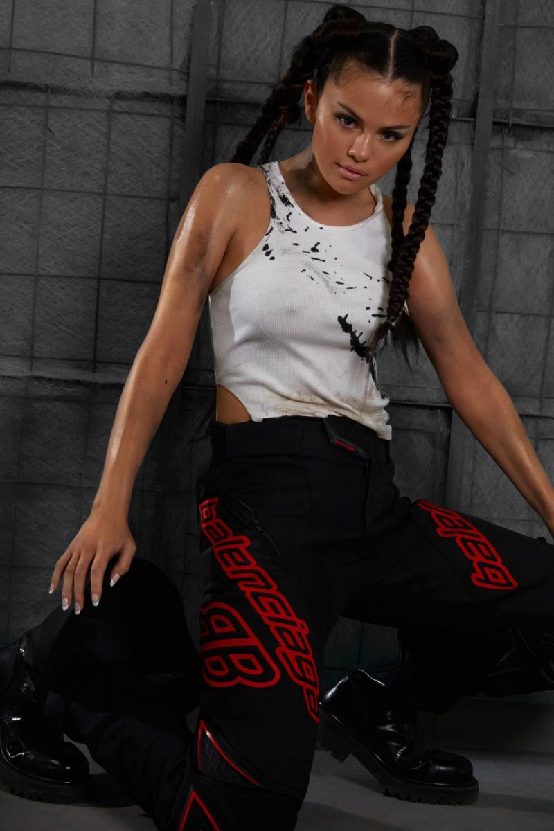 Selena Gomez braless boobs showing off her tits pokies in a white tank top as well as showing her ass in tight pants for Interview magazine.