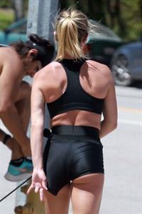 Sydney Sweeney sexy ass in tight little shorts was seen out jogging in LA by paparazzi also wearing a Nike sports bra to keep her famous big tits in place.