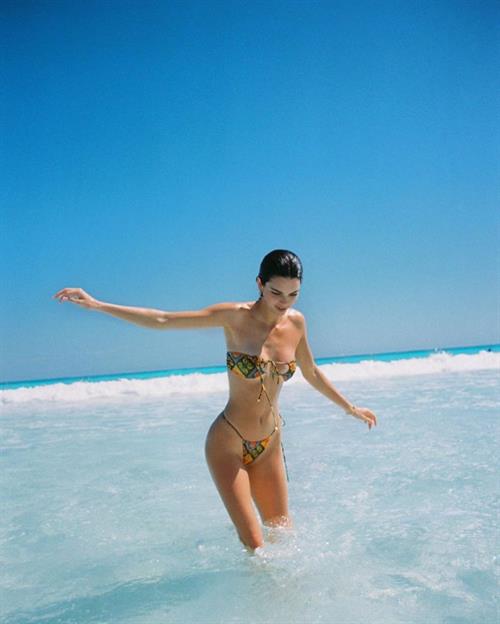Kendall Jenner Bikini Pictures Kendall Jenner shared some new photos from her family vacation from a few months ago wearing a sexy little thong bikini showing off her hot model body with Kylie Jenner.