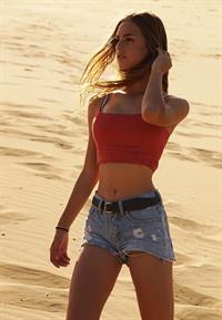 Emily Feld in Daisy Duke Jean Shorts and a Red Halter Top