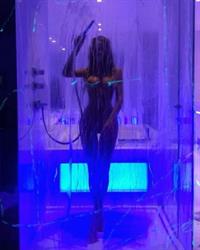 Sahara Ray nude new photos posing naked in her fancy shower showing her topless boobs and naked pussy behind her clear shower curtain.