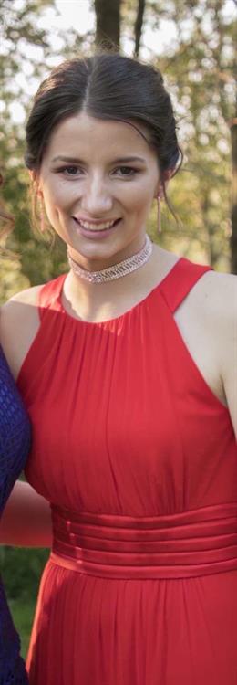 Gorgeous pic of Caitlin Gooch in a red formal dress.
