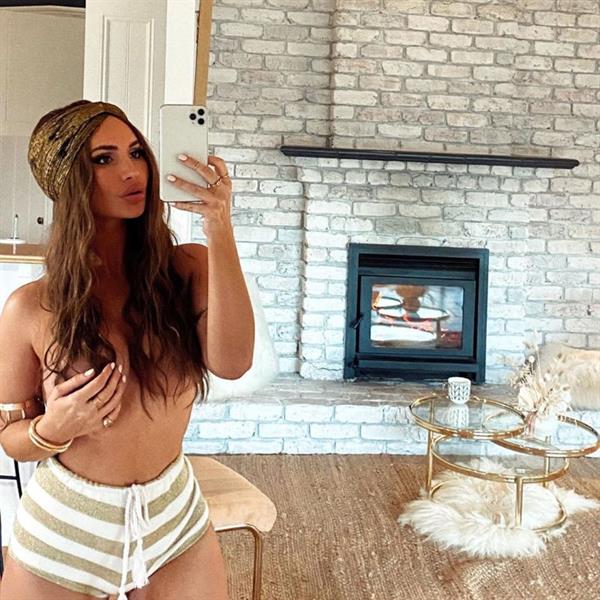 Rosanna Arkle nude boobs new photo she shared standing topless in her house with her hair covering her topless big tits.