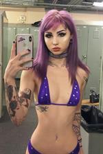 Valerica Steele in a bikini taking a selfie